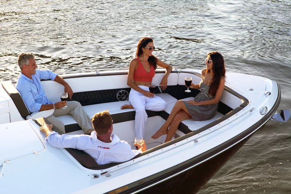 bow of boat with people sitting and talking